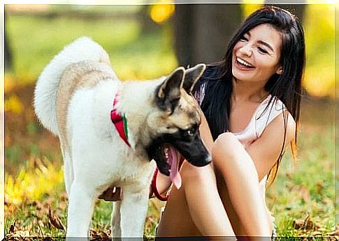 Laughing woman with dog